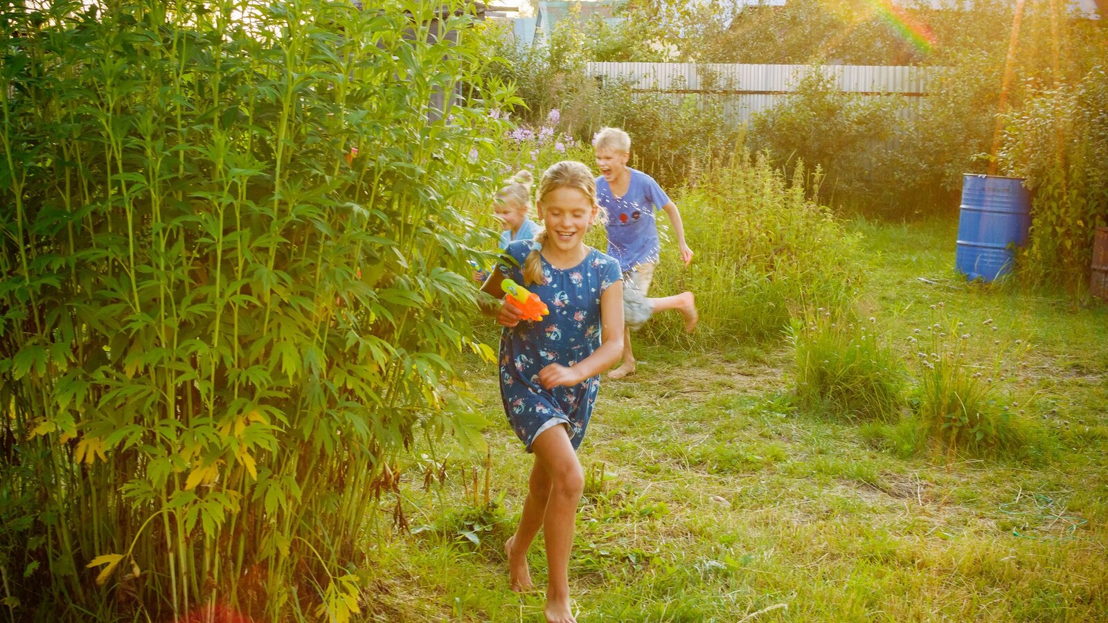 Children playing outdoors in the Little Oaks garden